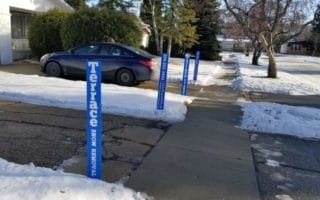 A Pair Of Seasonal Snow Removal Clients With Driveway Markers